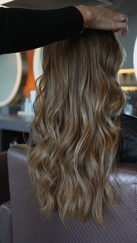 Beige balayage result shown from the back